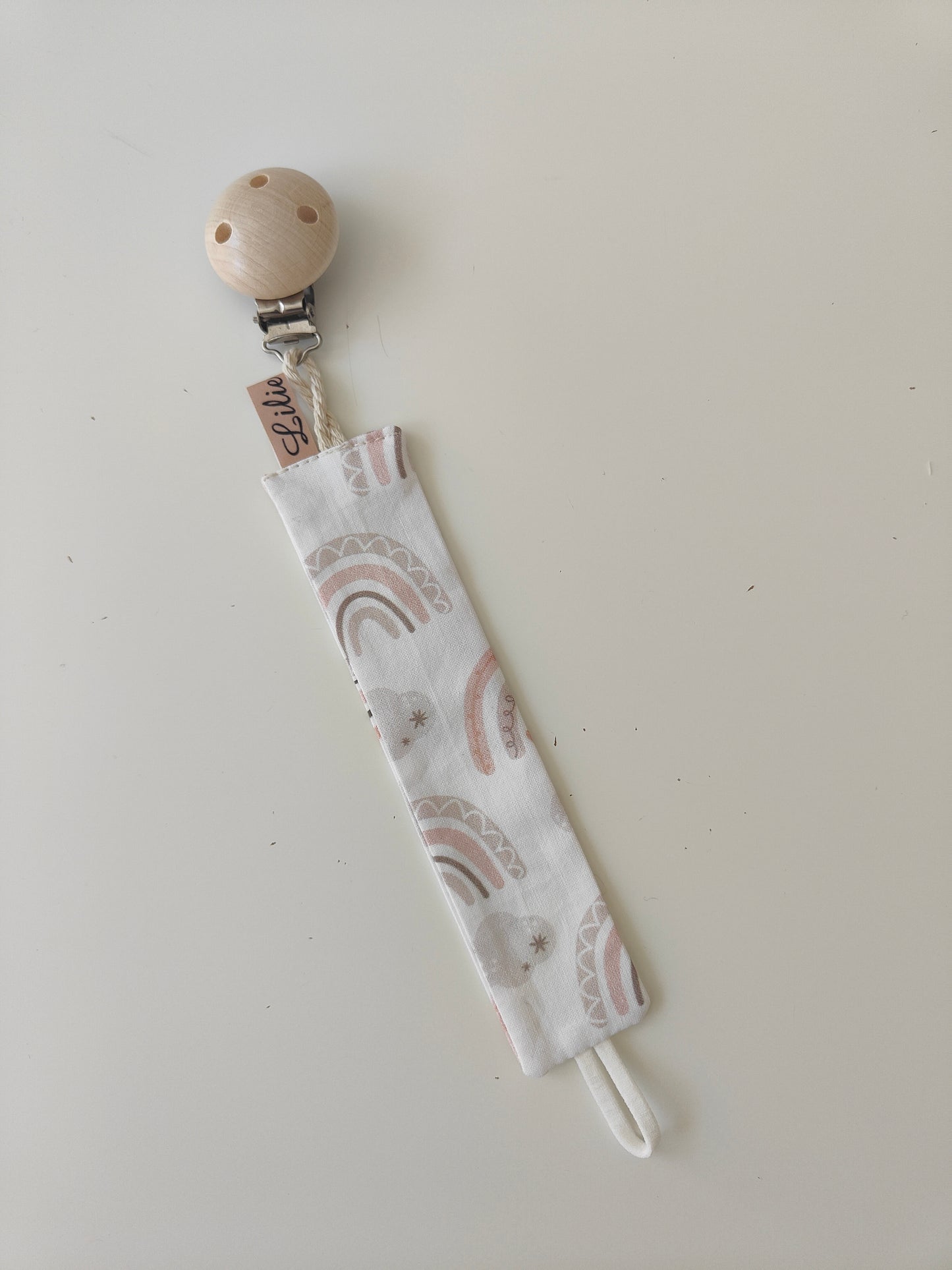 Schnullerband/Regenbogen/Creme